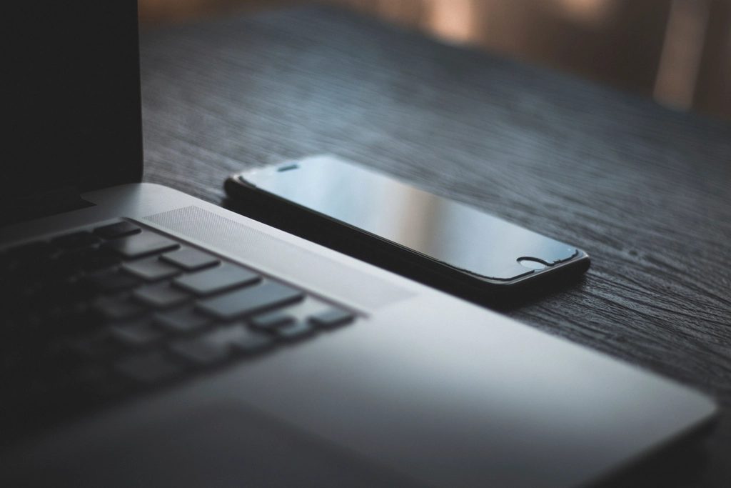 Illustrative photograph of macbook iPhone Desk Office