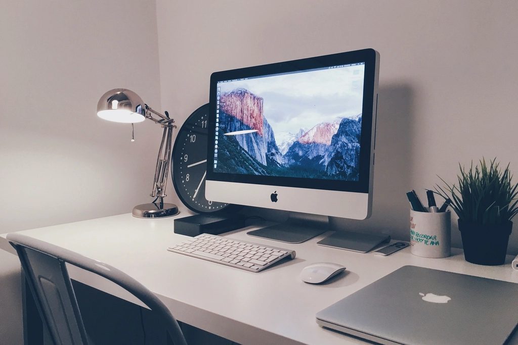 Illustrative photograph of apple iMac, creative workspace, location
